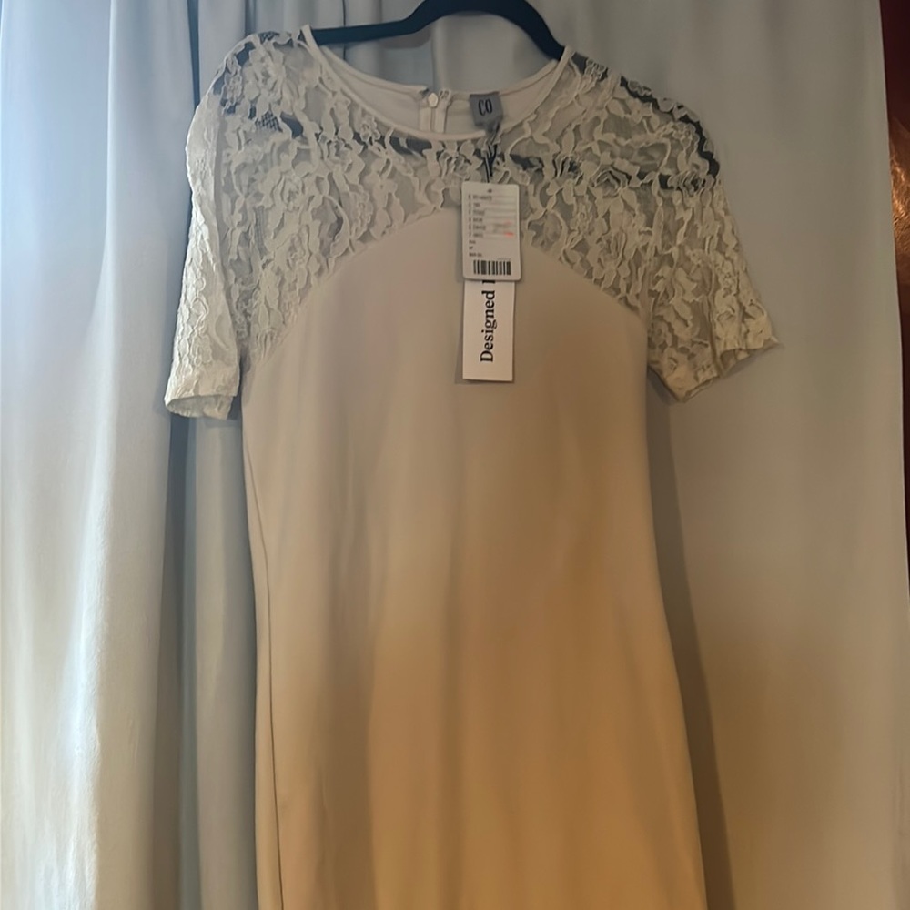 I’m 53 an dress fits a little above knee new with tags
